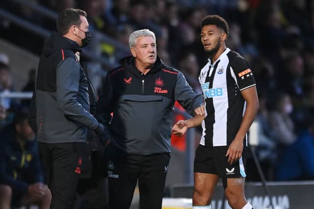 Newcastle manager Steve Bruce speaks to Joelinton of Newcastle during the pre-season friendly between Burton Albion and Newcastle United at the Pirelli Stadium on July 30, 2021 in Burton-upon-Trent, England.