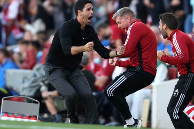 Mikel Arteta, Manager of Arsenal celebrates their side's third goal scored by Bukayo Saka (Photo by Julian Finney/Getty Images)