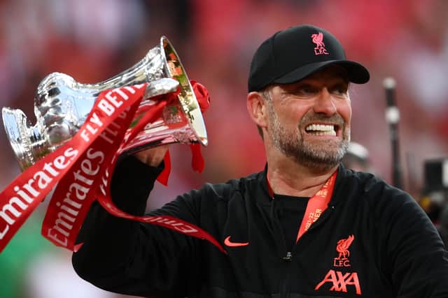Jurgen Klopp celebrates Liverpool’s FA Cup triumph with the trophy. Picture: Mike Hewitt/Getty Images