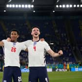 Jude Bellingham and Declan Rice of England celebrate after victory in the UEFA Euro 2020 Championship Quarter-final against Ukraine (Photo by Alessandra Tarantino - Pool/Getty Images)