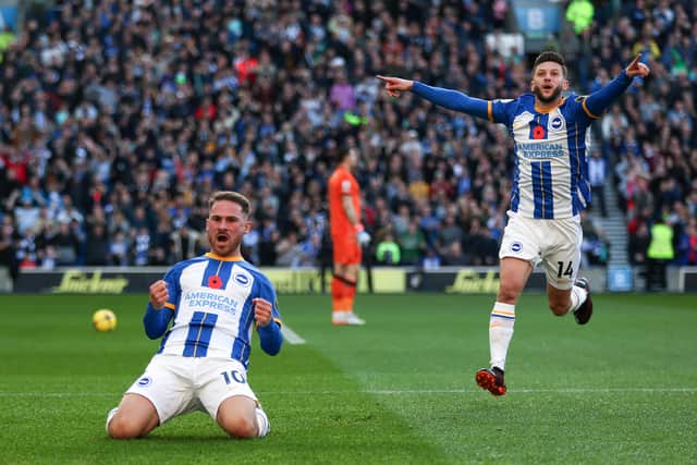 Alexis MacAllister of Brighton & Hove Albion celebrates after scoring their side’s first goal against Aston Villa (Photo by Christopher Lee/Getty Images)