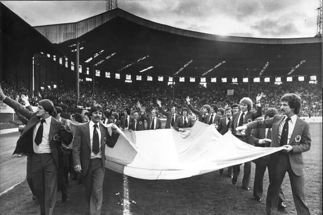 Scotland players with an Argentinian flag in 1978, acknowledge the emotional send-off form the thousands of fans at Hampden.