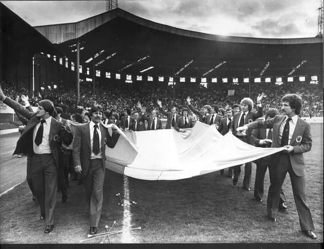 Scotland players with an Argentinian flag in 1978, acknowledge the emotional send-off form the thousands of fans at Hampden.
