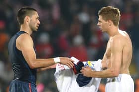 England’s midfielder Steven Gerrard (R).