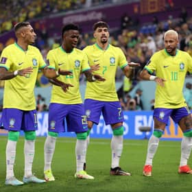 Vinicius Junior of Brazil celebrates with Raphinha, Lucas Paqueta and Neymar after scoring the team’s first goal during the (Photo by Michael Steele/Getty Images)