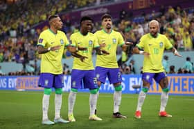 Vinicius Junior of Brazil celebrates with Raphinha, Lucas Paqueta and Neymar after scoring the team’s first goal during the (Photo by Michael Steele/Getty Images)