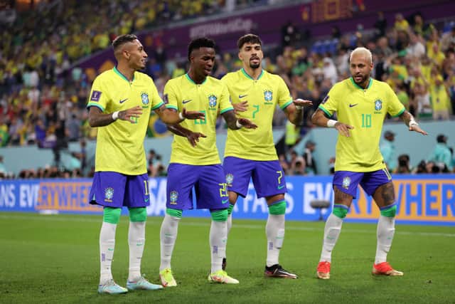 Vinicius Junior of Brazil celebrates with Raphinha, Lucas Paqueta and Neymar after scoring the team’s first goal during the (Photo by Michael Steele/Getty Images)