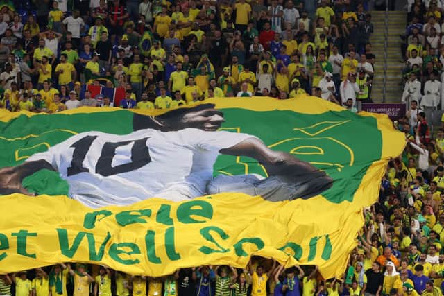 Brazil fans hold a banner showing support for former Brazil player Pele. (Photo by Michael Steele/Getty Images)