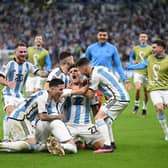  Argentina players celebrate after their win in the penalty shootout during the FIFA World Cup Qatar 2022 quarter final  (Photo by Matthias Hangst/Getty Images)