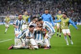 Argentina players celebrate after their win in the penalty shootout during the FIFA World Cup Qatar 2022 quarter final  (Photo by Matthias Hangst/Getty Images)