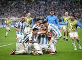  Argentina players celebrate after their win in the penalty shootout during the FIFA World Cup Qatar 2022 quarter final  (Photo by Matthias Hangst/Getty Images)
