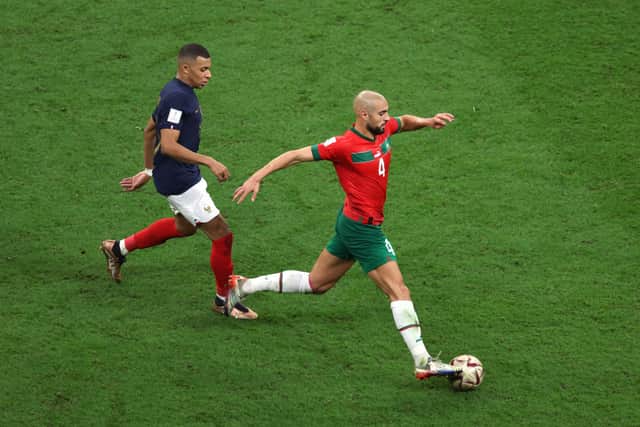 Moroccan battler Sofyan Amrabat, a man who appears to be the illicit love child of Predator and a robot vacuum cleaner.