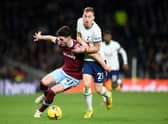 Dejan Kulusevski wrestles with Declan Rice. (Photo by Justin Setterfield/Getty Images)