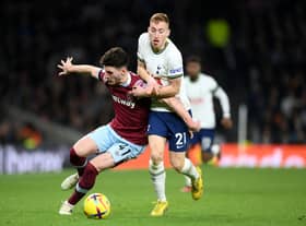 Dejan Kulusevski wrestles with Declan Rice. (Photo by Justin Setterfield/Getty Images)