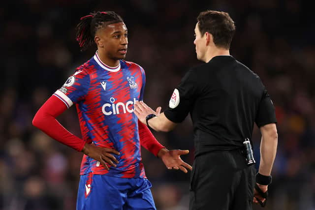 Michael Olise of Crystal Palace speaks with Referee Darren England during the Premier League  (Photo by Catherine Ivill/Getty Images)