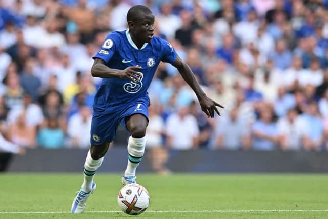 Chelsea’s French midfielder N’Golo Kante runs with the ball during the English Premier League football match (Photo by GLYN KIRK/AFP via Getty Images)