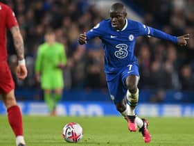 Chelsea’s French midfielder N’Golo Kante runs with the ball during the English Premier League football match (Photo by GLYN KIRK/AFP via Getty Images)
