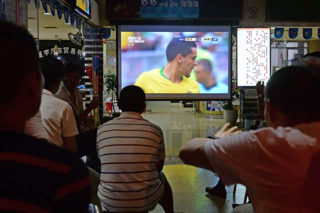 Fans in Shanghai watch the 2018 World Cup in a China Sports Lottery outlet.