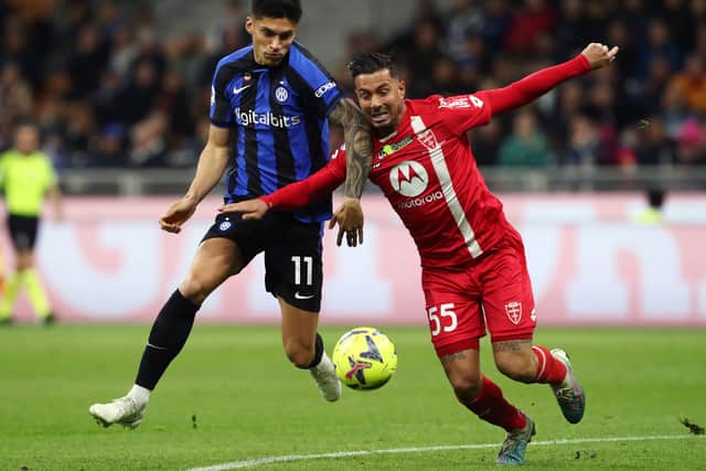 Joaquín Correa, left, battles for the ball against Monza in Serie A