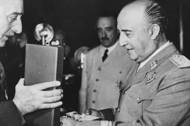 General Franco, right, exchanging accolades with the Greek Prime Minister Marshal Papagos in 1954