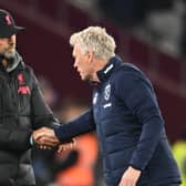 Jurgen Klopp manager of Liverpool with West Ham United manager David Moyes   during the Premier League match between West Ham United and Liverpool FC at London Stadium on April 26, 2023 in London, England. (Photo by Andrew Powell/Liverpool FC via Getty Images)