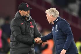 Jurgen Klopp manager of Liverpool with West Ham United manager David Moyes   during the Premier League match between West Ham United and Liverpool FC at London Stadium on April 26, 2023 in London, England. (Photo by Andrew Powell/Liverpool FC via Getty Images)