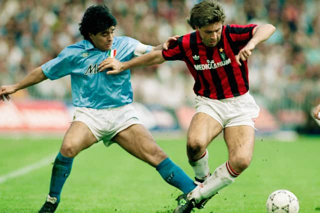 Carlo Ancelotti fends off a challenge from Diego Maradona.