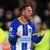 Alexis Mac Allister celebrates scoring a goal for Brighton