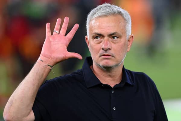 Jose Mourinho signals to the five European trophies he has won