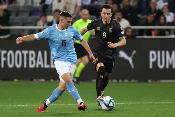 Israel’s midfielder Oscar Gloukh (L) is marked by Kosovo’s midfielder Bersant Celina during the UEFA Euro 2024 group  (Photo by JACK GUEZ/AFP via Getty Images)