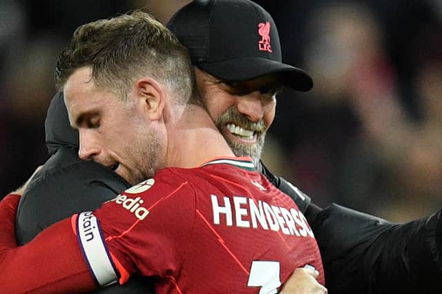 Liverpool manager Juren Klopp with Jordan Henderson. Picture: OLI SCARFF/AFP via Getty Images
