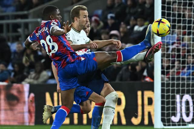Crystal Palace’s Cheick Doucoure challenges Tottenham Hotspur’s Harry Kane
