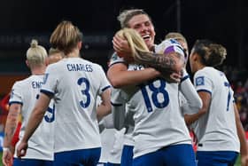 England’s Chloe Kelly is embraced by Millie Bright after scoring a goal at the World Cup