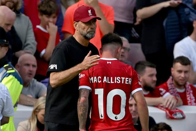 Alexis Mac Allister of Liverpool with Jurgen Klopp manager of Liverpool after being shown a red card during the Premier League match between Liverpool FC and AFC Bournemouth at Anfield on August 19, 2023 in Liverpool, England. (Photo by Andrew Powell/Liverpool FC via Getty Images)
