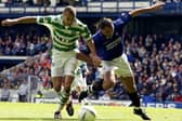 Henrik Larsson of Celtic is tackled by Lorenzo Amoruso of Rangers during the Bank of Scotland Scottish Premier League match between Glasgow Rangers and Glasgow Celtic held on April 27, 2003 at the Ibrox Stadium