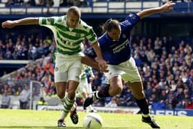  Henrik Larsson of Celtic is tackled by Lorenzo Amoruso of Rangers during the Bank of Scotland Scottish Premier League match between Glasgow Rangers and Glasgow Celtic held on April 27, 2003 at the Ibrox Stadium