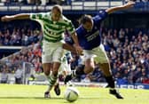  Henrik Larsson of Celtic is tackled by Lorenzo Amoruso of Rangers during the Bank of Scotland Scottish Premier League match between Glasgow Rangers and Glasgow Celtic held on April 27, 2003 at the Ibrox Stadium