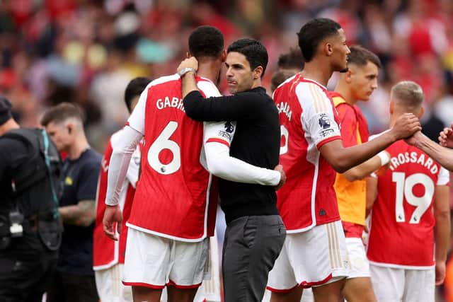 Arsenal manager Mikel Arteta with his players. The Gunners host Manchester United in the Premier League on Sunday afternoon - check out our predicted line-up below.