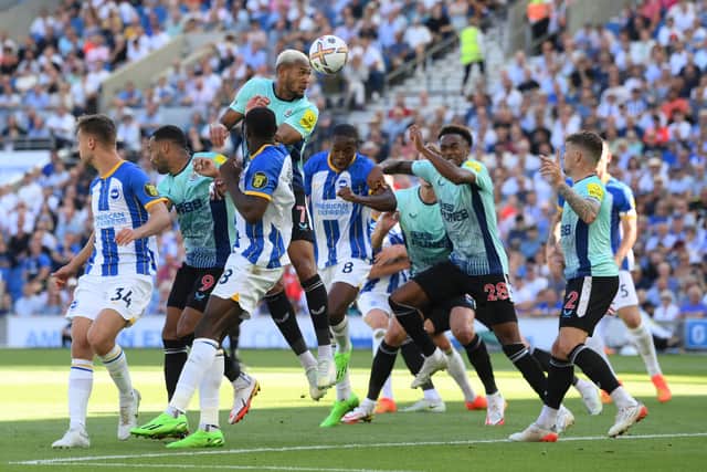 Joelinton of Newcastle United heads the ball during the Premier League match between Brighton & Hove Albion and Newcastle United at American Express Community Stadium on August 13, 2022 in Brighton, England. (Photo by Mike Hewitt/Getty Images)