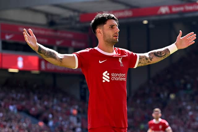 Dominik Szoboszlai of Liverpool celebrates after scoring the opening goal during the Premier League match between Liverpool FC and Aston Villa at Anfield on September 03, 2023 in Liverpool, England. (Photo by Andrew Powell/Liverpool FC via Getty Images)