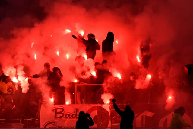 Members of the Bad Gones group wave flares ahead of a match against Marseille in 2017.