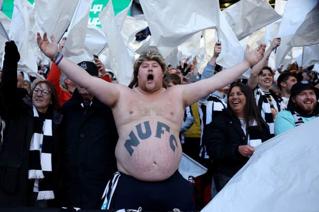 A Newcastle United fan on the terraces. The Magpies have taken great delight in flaunting their new European status over bitter rivals Sunderland in recent times.