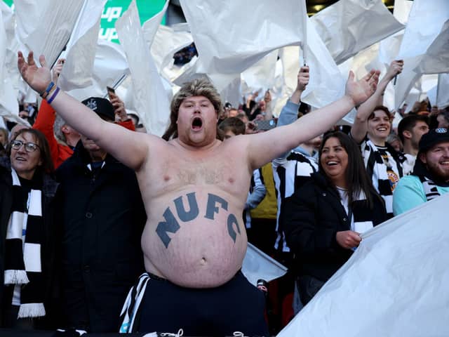 A Newcastle United fan on the terraces. The Magpies have taken great delight in flaunting their new European status over bitter rivals Sunderland in recent times.