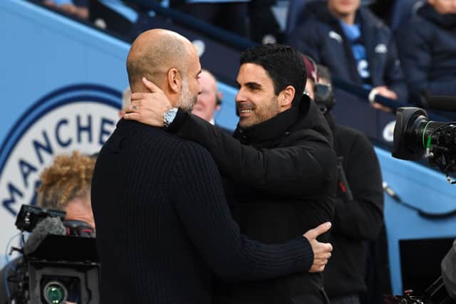 Arsenal manager Mikel Arteta and Man City boss Pep Guardiola. The Gunners are being linked with a potential swoop for City midfielder Kalvin Phillips. 