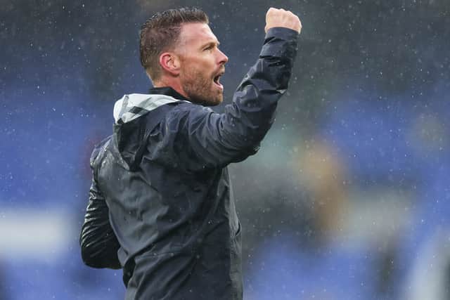 Rob Edwards celebrates Luton Town’s first Premier League win in the Goodison Park rain.