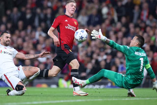 Rasmus Højlund dinks the ball past Fernando Muslera for his second goal of the evening.