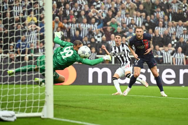 Miguel Almiron of Newcastle United scores the team’s first goal during the UEFA Champions League match between Newcastle United FC and Paris Saint-Germain at St. James Park on October 04, 2023 in Newcastle upon Tyne, England.