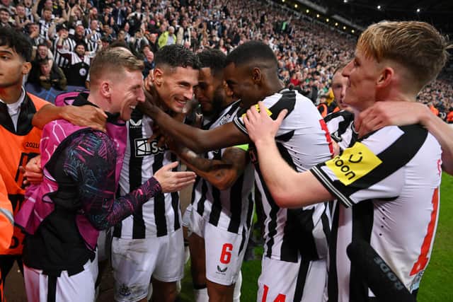 abian Schar of Newcastle United celebrates with teammates after scoring the team's fourth goal during the UEFA Champions League match between Newcastle United FC and Paris Saint-Germain at St. James Park on October 04, 2023 in Newcastle upon Tyne, England. (Photo by Stu Forster/Getty Images)