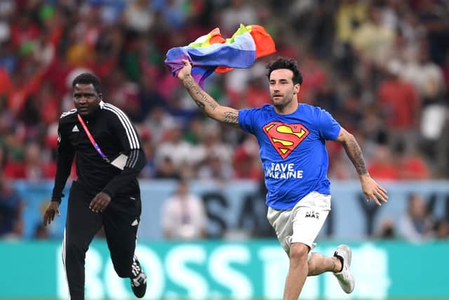 A protestor who ran onto the field during Portugal v Ukraine in Qatar 2022 with a rainbow flag was detained by authorities before being released and having his visa revoked.