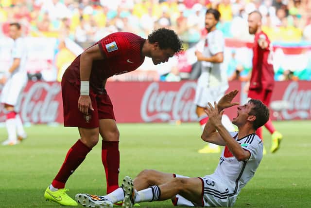 Pepe exchanges some pleasantries with Thomas Müller during the 2014 World Cup.